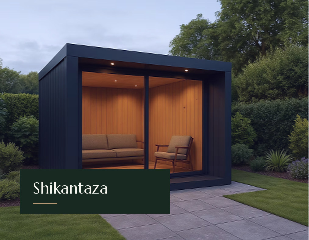 Black-clad Shikantaza studio with a wide glazed front and a calm lounge interior